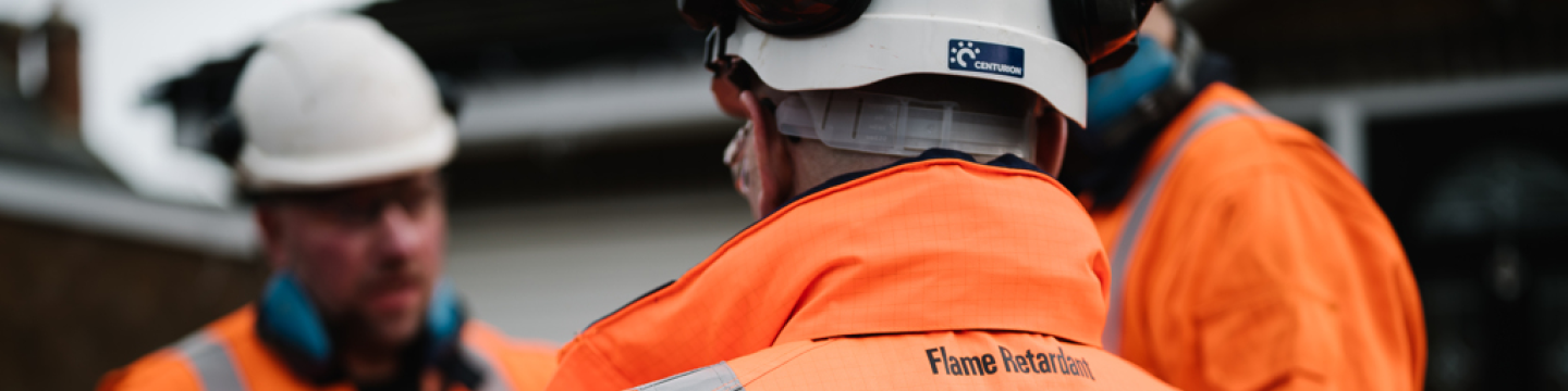 Three Northumbrian Water workers talking