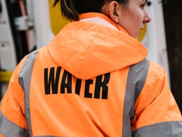 Northumbrian Water worker wearing orange jacket